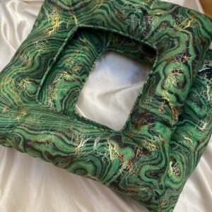 Green velvet Yoni steam cushion with gold marble pattern and central opening