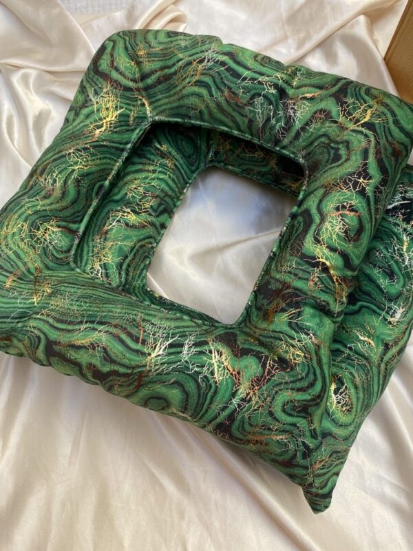 Green velvet Yoni steam cushion with gold marble pattern and central opening