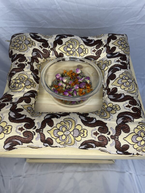 Green velvet Yoni steam cushion with gold marble pattern and central opening